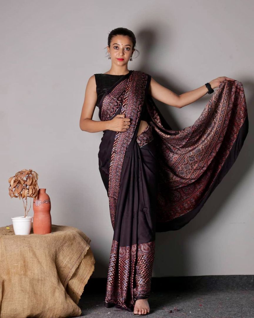 Handcrafted black modal silk saree adorned with traditional Ajrakh patterns and refined detailing