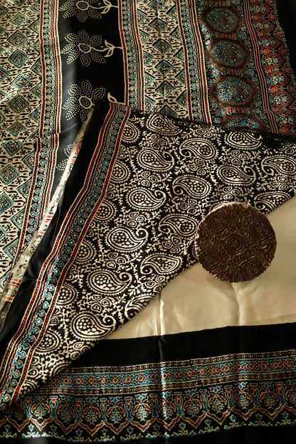 Handcrafted black sunflower modal silk saree adorned with traditional Ajrakh patterns and floral-inspired detailing