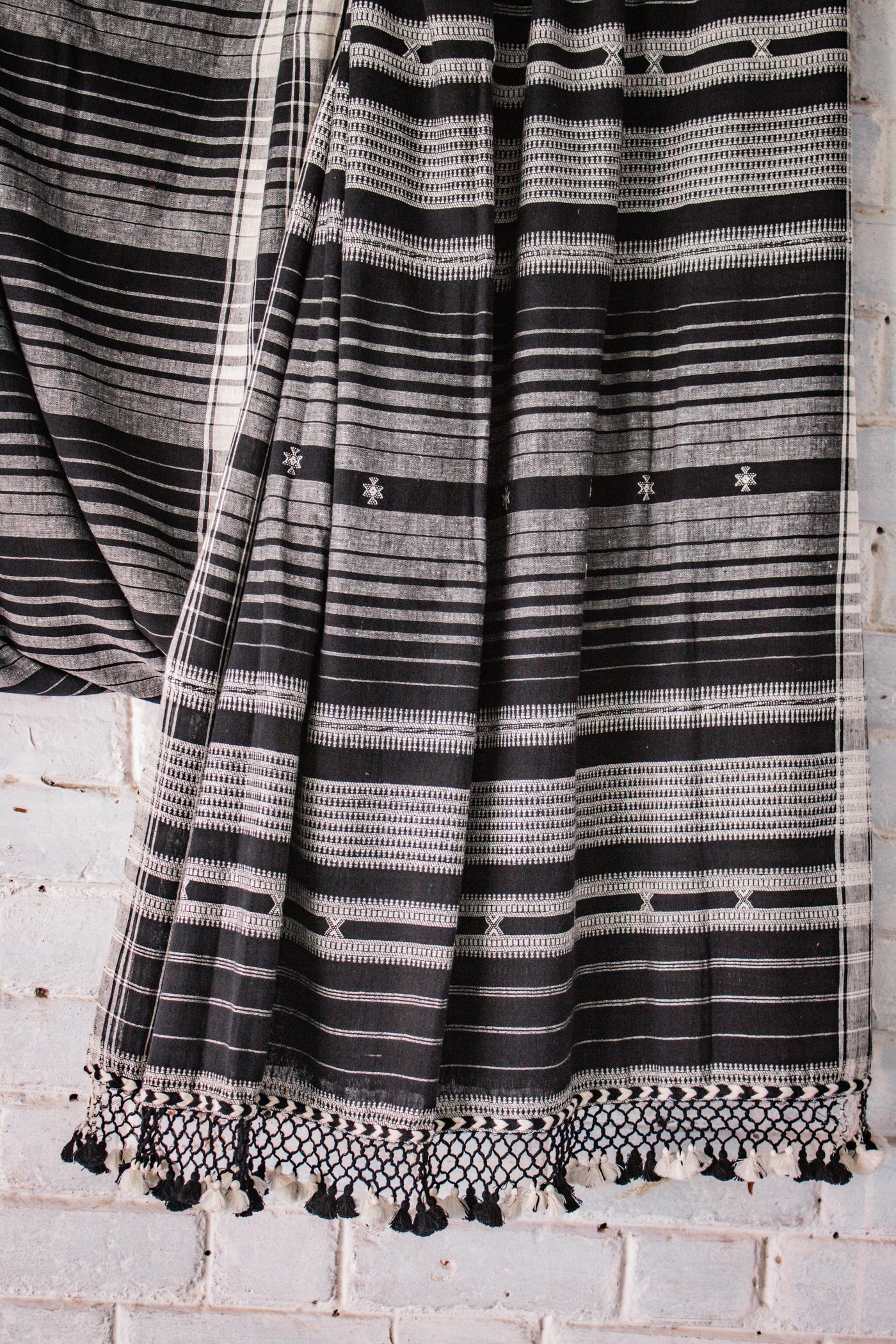 Charcoal Kala Cotton Bhujodi saree featuring traditional handwoven patterns and artisanal craftsmanship