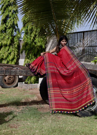 Handcrafted cherry Kala Cotton saree adorned with authentic Bhujodi weaving and heritage-inspired motifs