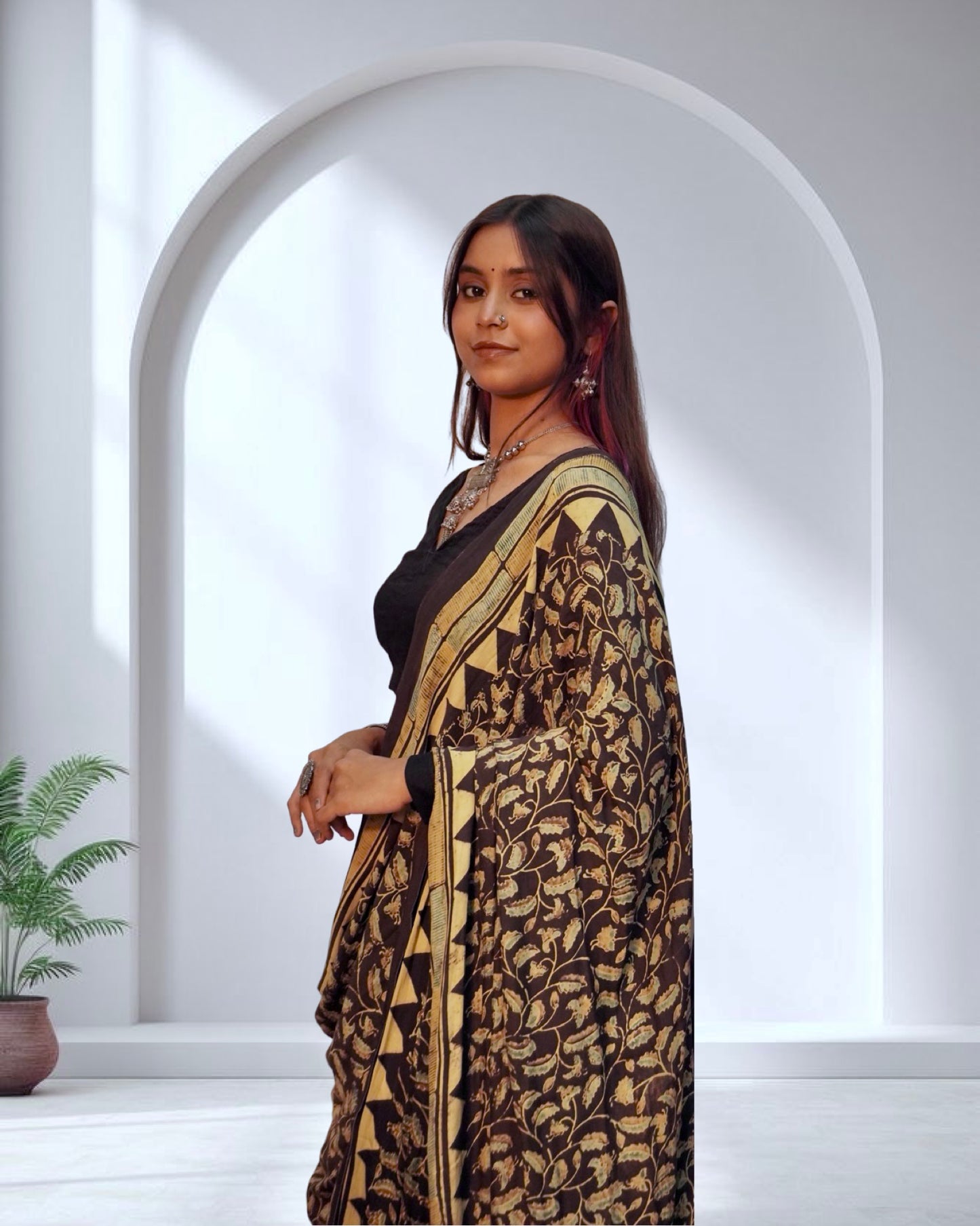 Handcrafted chocolate brown modal silk saree adorned with traditional Ajrakh patterns and artisanal detailing