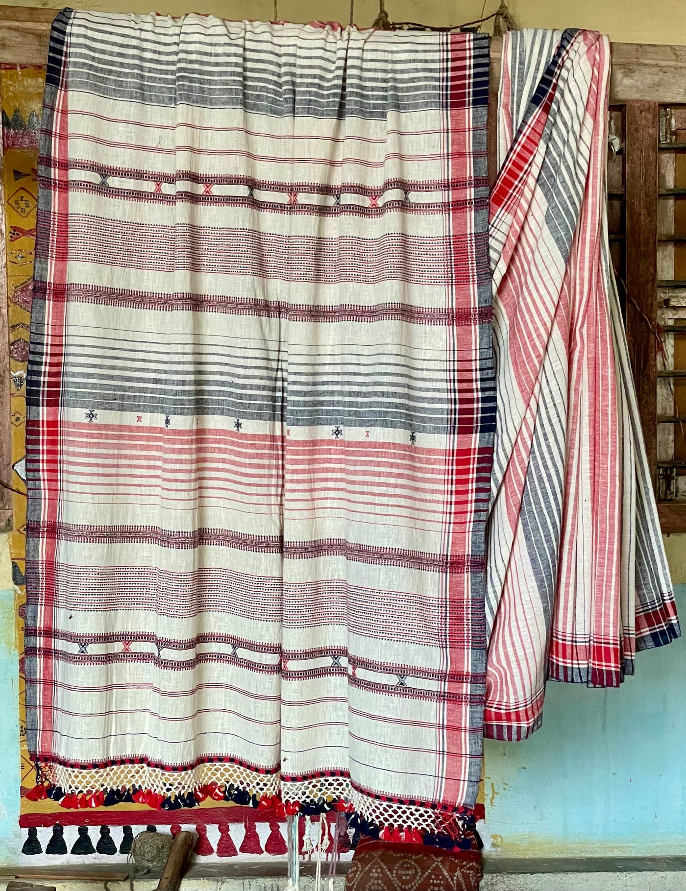 Handcrafted cloud Kala Cotton saree adorned with authentic Bhujodi weaving and heritage-inspired motifs