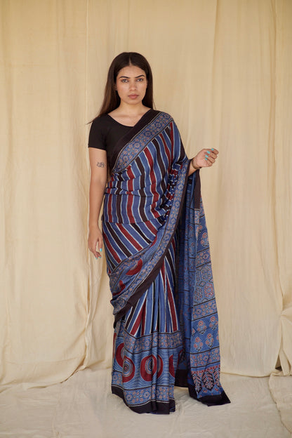 Handcrafted cobalt blue modal silk saree adorned with traditional Ajrakh patterns and refined detailing