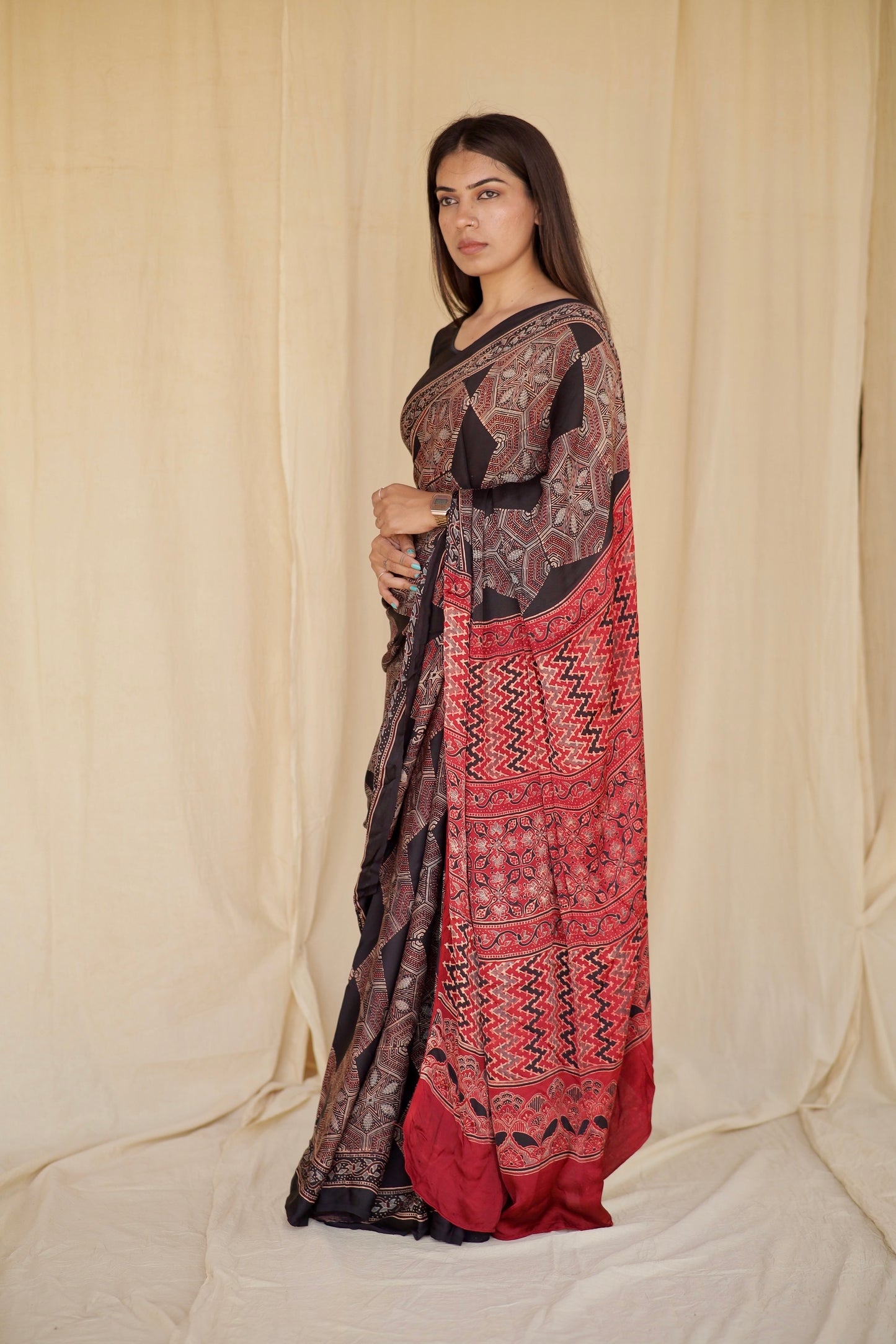 Handcrafted dark mocha modal silk saree adorned with traditional Ajrakh patterns and refined detailing