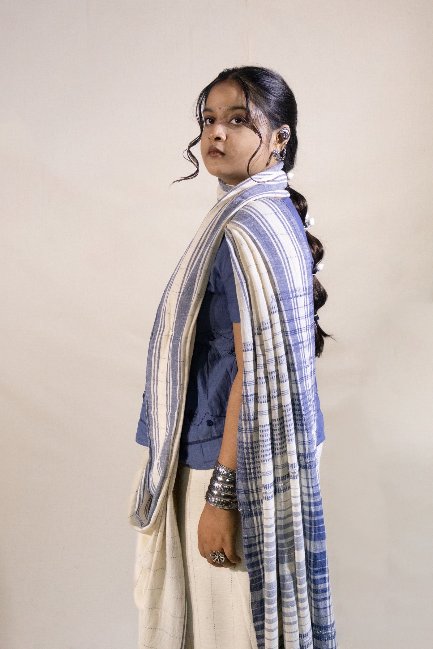 Handcrafted denim Kala Cotton saree adorned with authentic Bhujodi weaving and heritage-inspired motifs