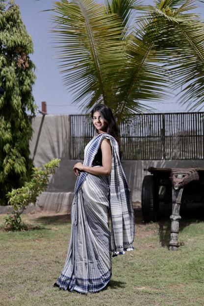 Handcrafted dusk Kala Cotton saree adorned with authentic Bhujodi weaving and heritage-inspired motifs