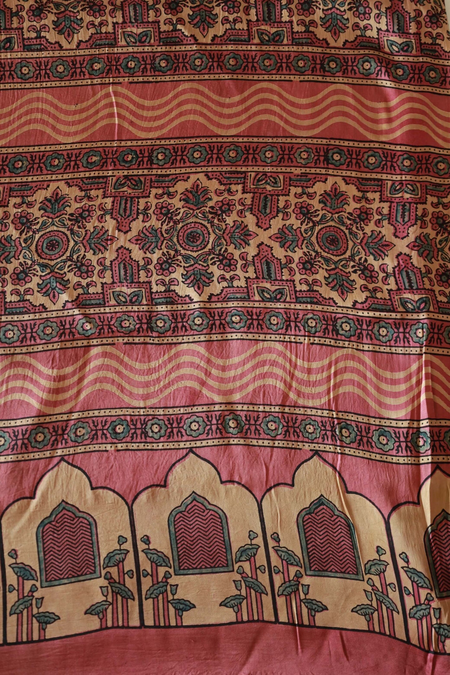 Handcrafted dusty rose flamingo modal silk saree adorned with traditional Ajrakh patterns and artisanal detailing