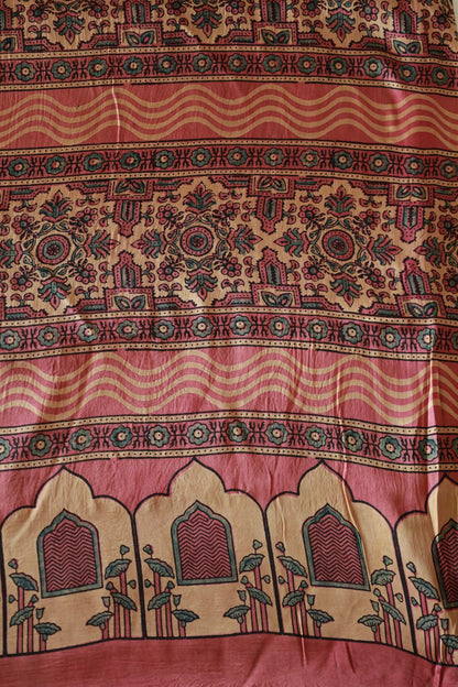 Handcrafted dusty rose flamingo modal silk saree adorned with traditional Ajrakh patterns and artisanal detailing