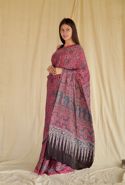 Handcrafted fuchsia pink modal silk saree adorned with traditional Ajrakh patterns and vibrant detailing