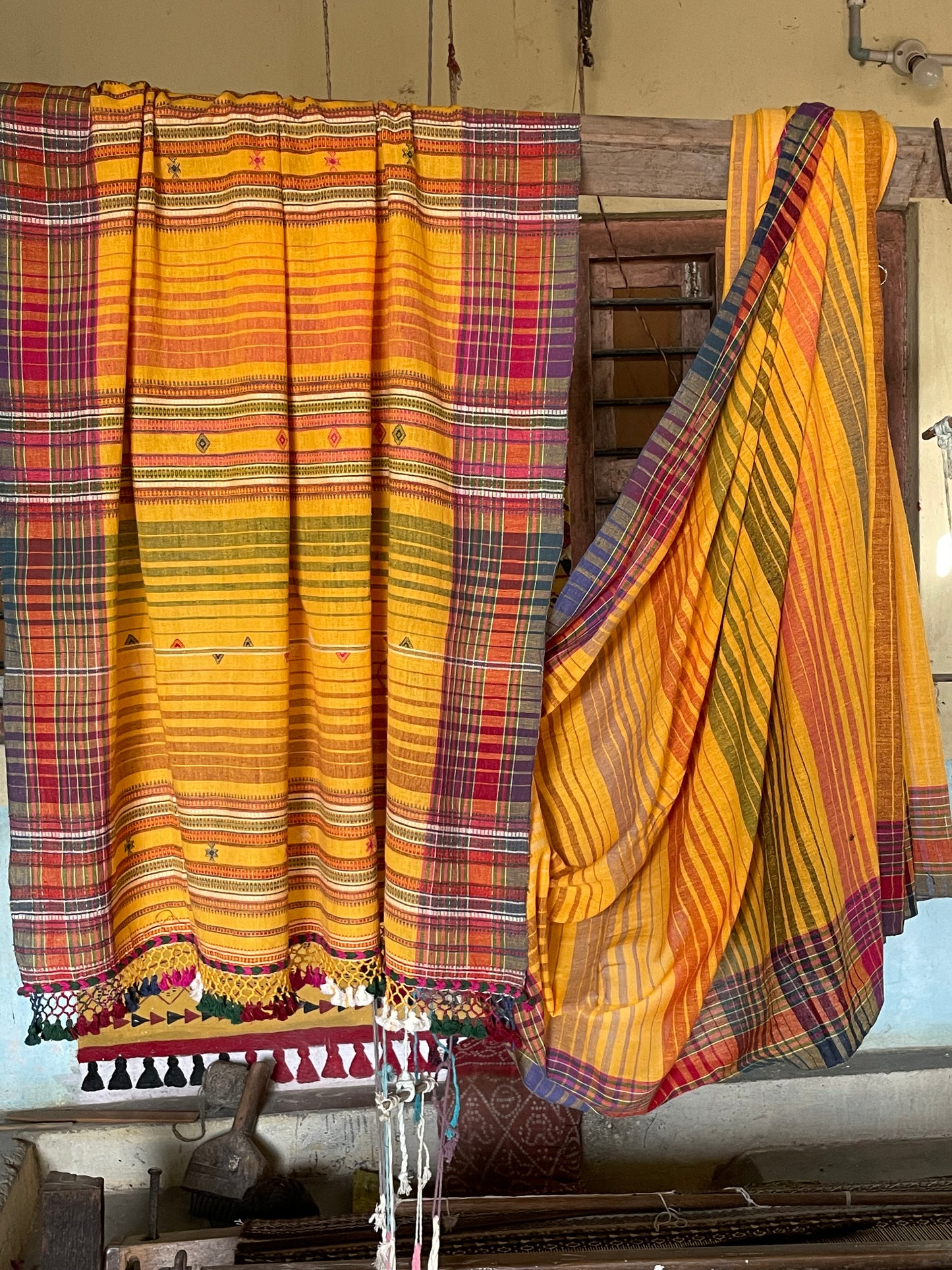 Handcrafted golden Kala Cotton saree adorned with authentic Bhujodi weaving and heritage-inspired motifs