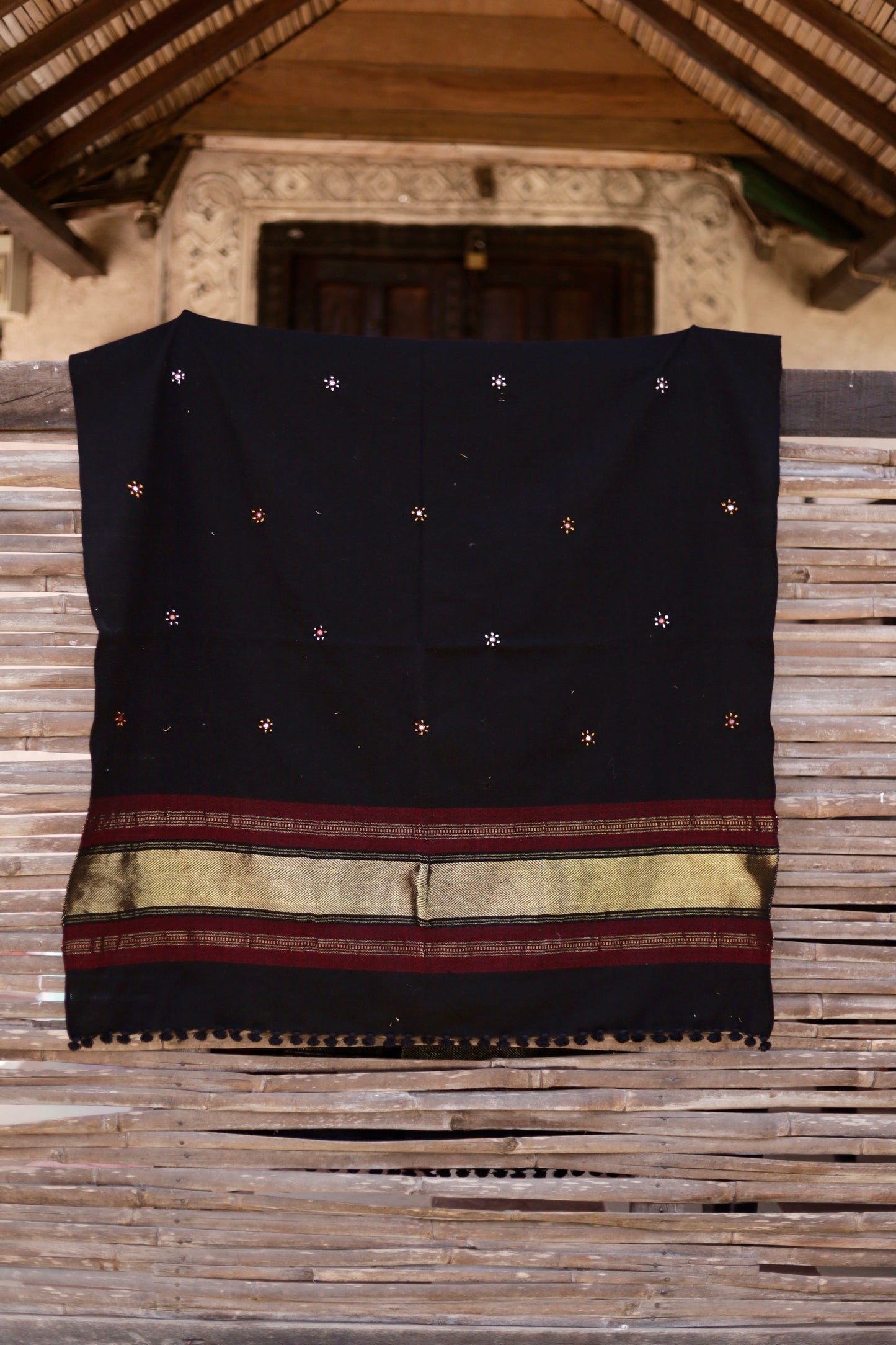 Midnight black handwoven woolen shawl featuring a rich texture and masterful artisan craftsmanship