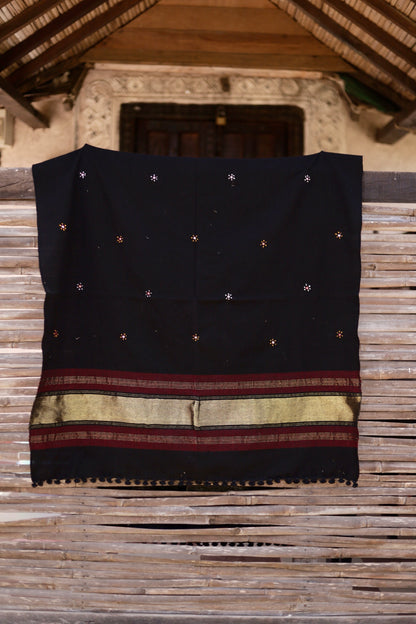 Midnight black handwoven woolen shawl featuring a rich texture and masterful artisan craftsmanship
