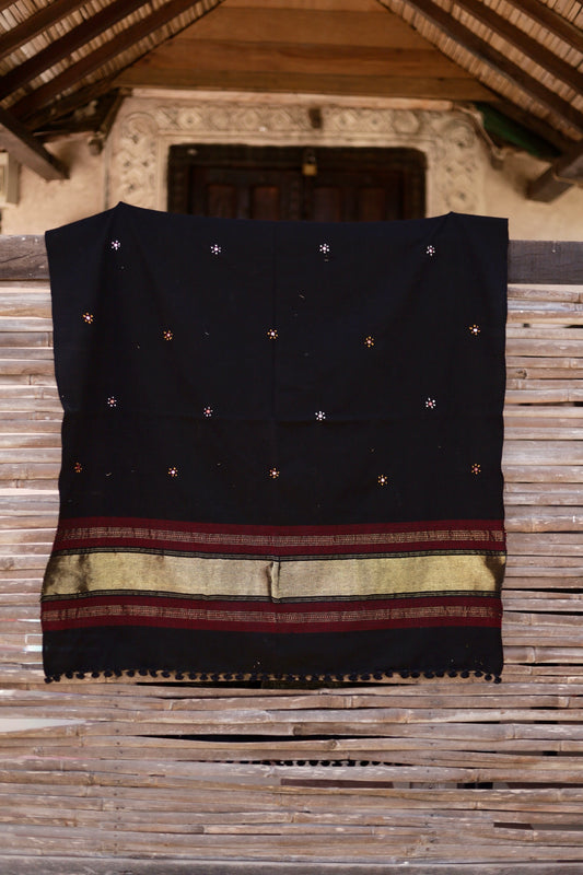 Midnight black handwoven woolen shawl featuring a rich texture and masterful artisan craftsmanship