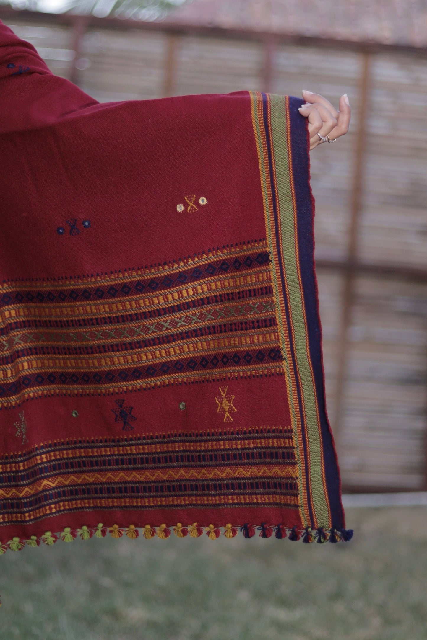 Classic handwoven woolen shawl in burgundy designed for warmth, comfort, and versatile styling