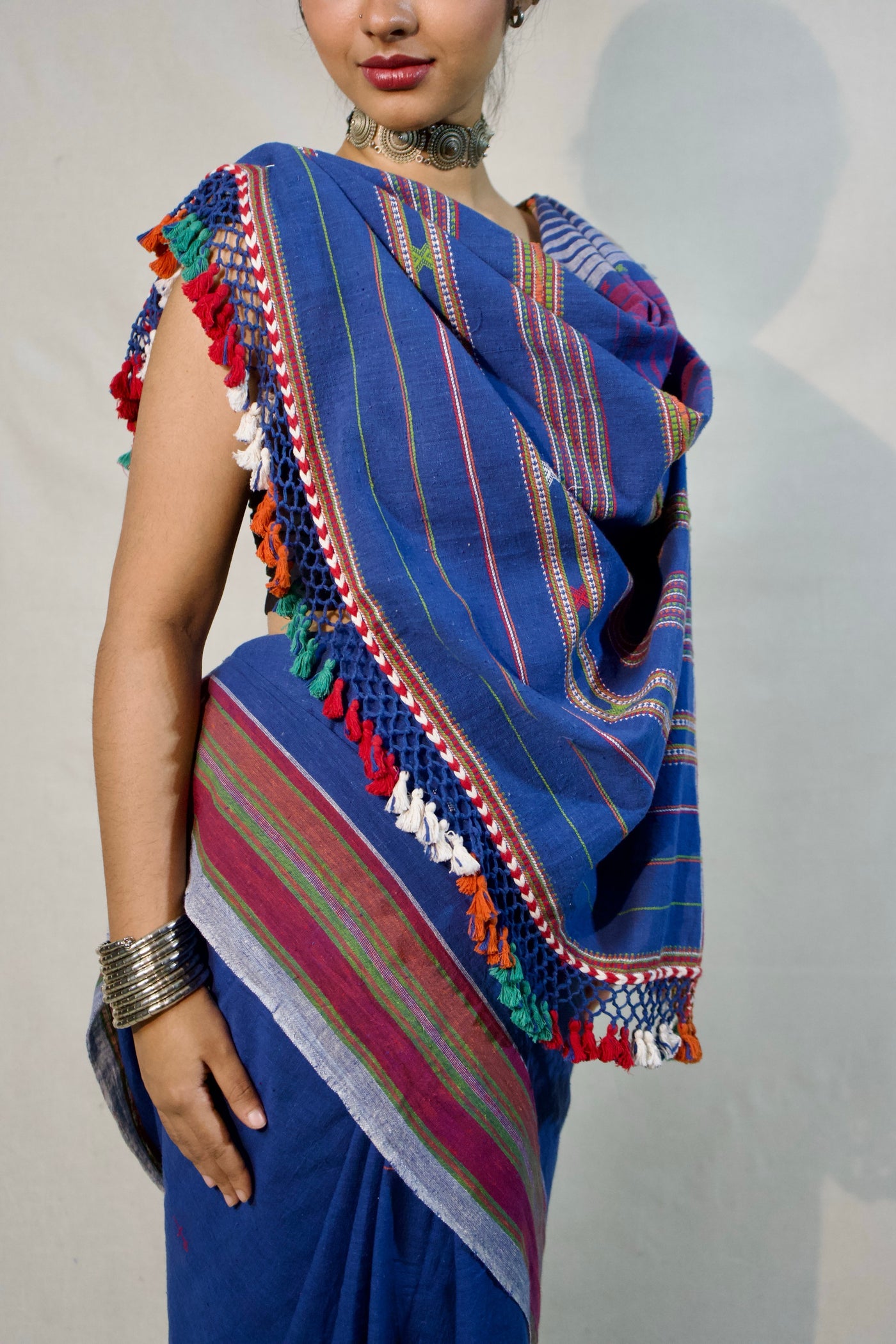 Handcrafted indigo Kala Cotton saree adorned with authentic Bhujodi weaving and heritage-inspired motifs