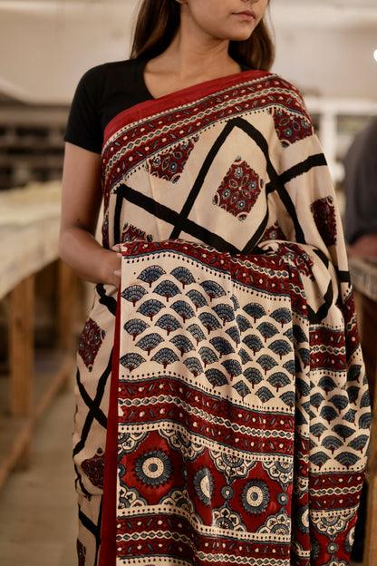 Handcrafted ivory black modal silk saree adorned with traditional Ajrakh patterns and artisanal detailing