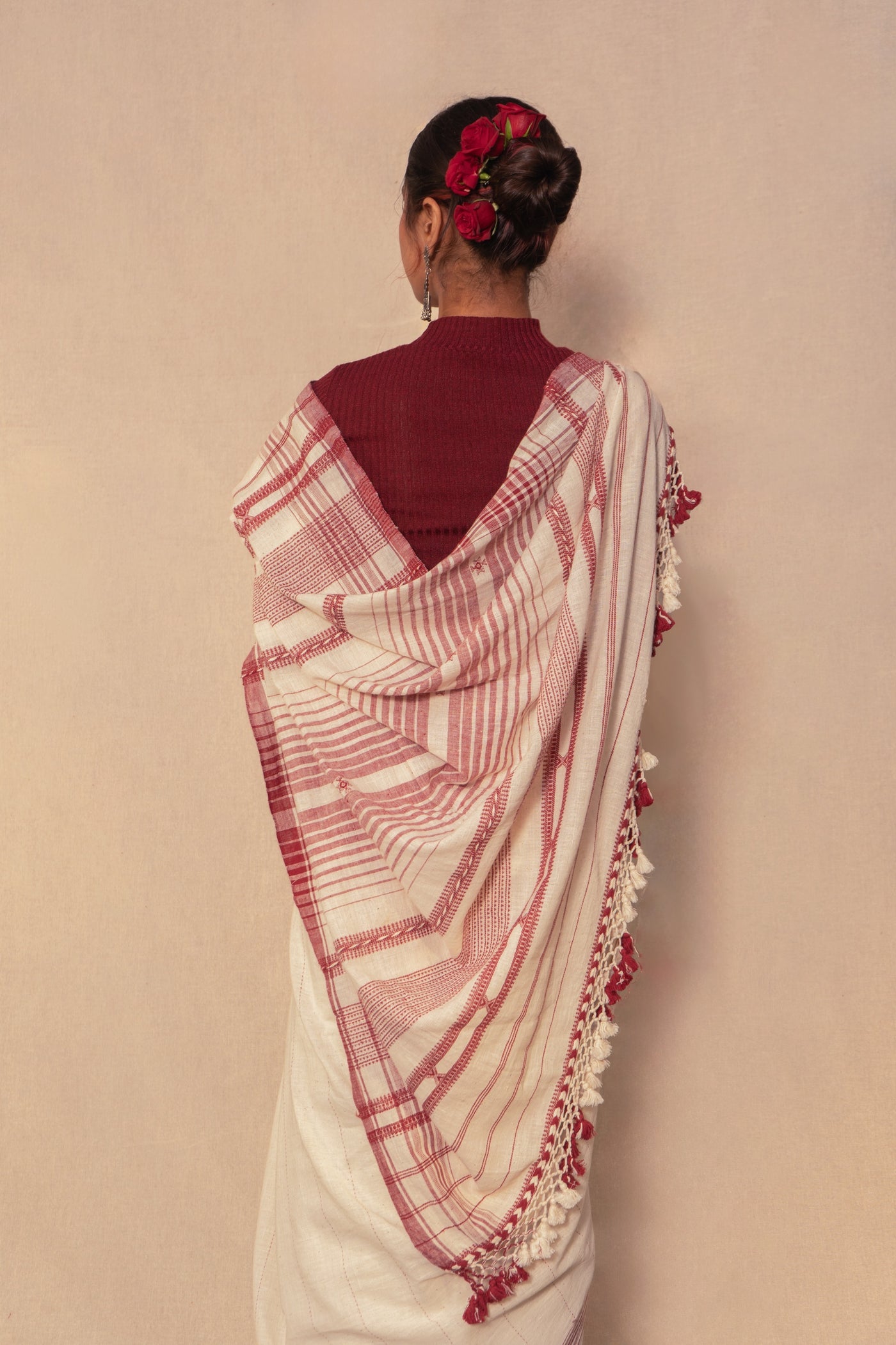 Handcrafted ivory Kala Cotton saree adorned with authentic Bhujodi weaving and heritage-inspired motifs