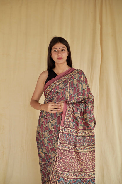 Handcrafted mauve pink modal silk saree adorned with traditional Ajrakh patterns and soft luxurious texture