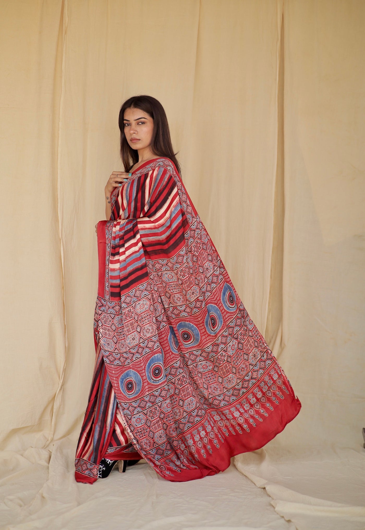 Handcrafted multicolor striped modal silk saree adorned with traditional Ajrakh patterns and vibrant detailing