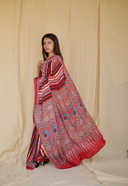 Handcrafted multicolor striped modal silk saree adorned with traditional Ajrakh patterns and vibrant detailing