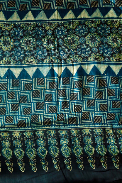 Handcrafted navy teal modal silk saree adorned with traditional Ajrakh patterns and artisanal detailing