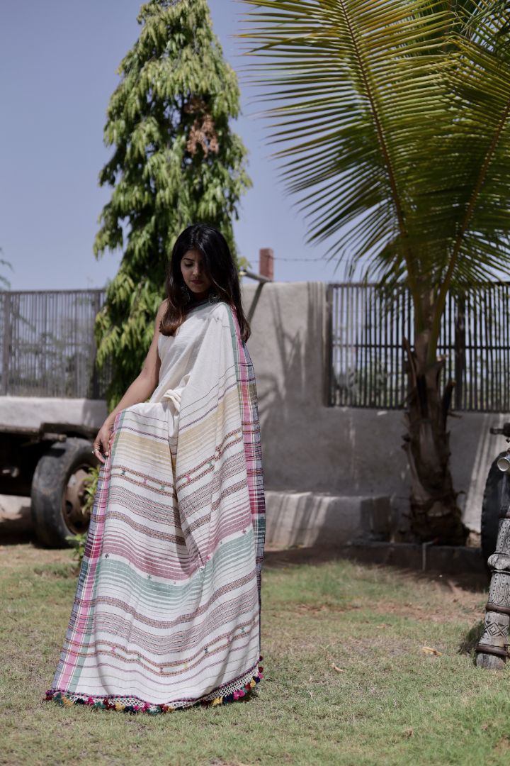 Handcrafted pearl Kala Cotton saree adorned with authentic Bhujodi weaving and heritage-inspired motifs