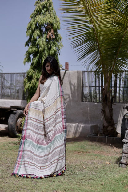 Handcrafted pearl Kala Cotton saree adorned with authentic Bhujodi weaving and heritage-inspired motifs