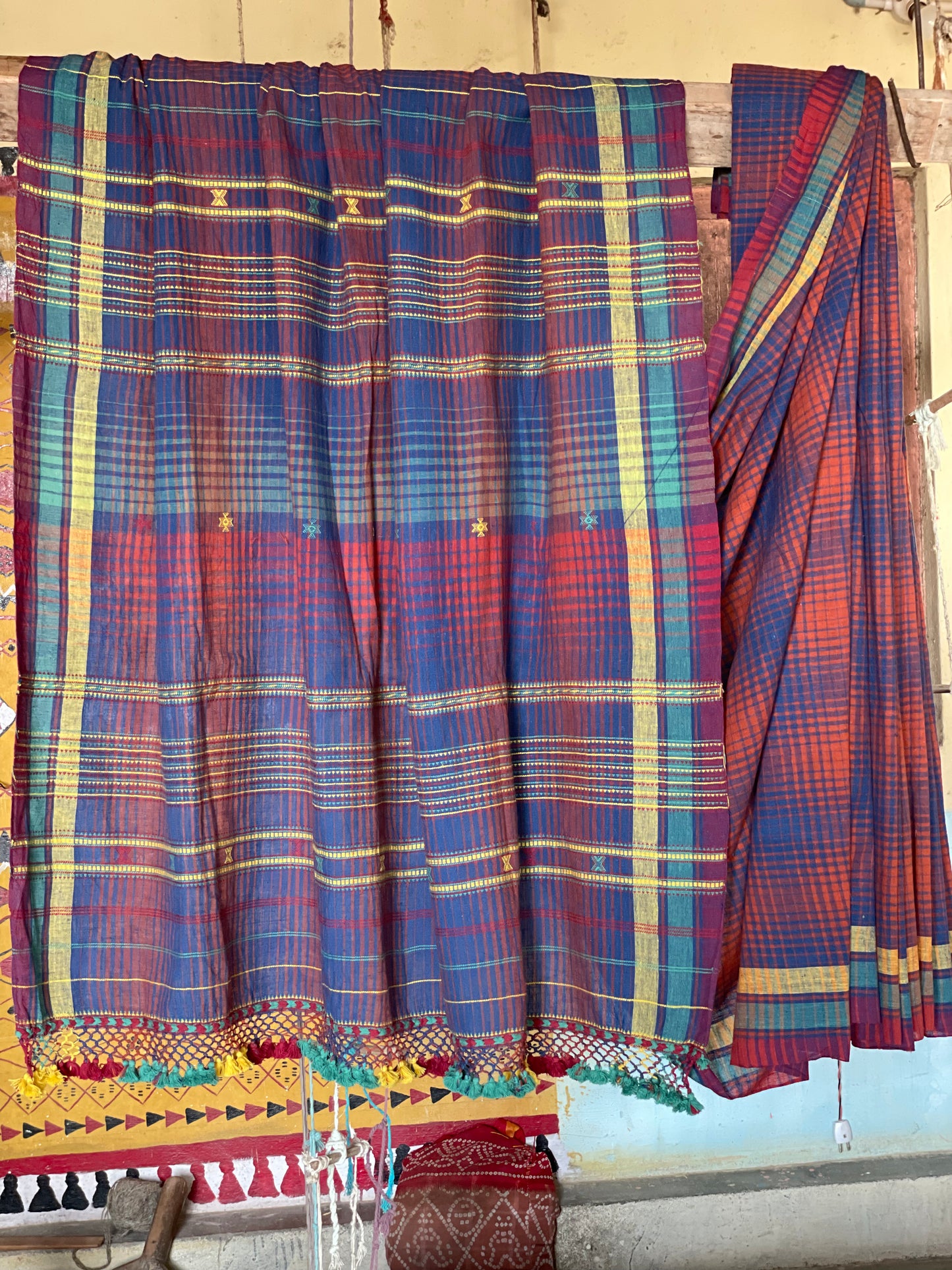 Handcrafted plum Kala Cotton saree adorned with authentic Bhujodi weaving and heritage-inspired motifs