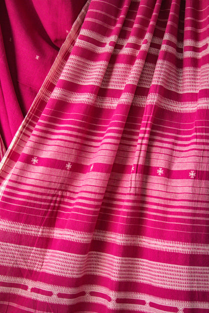 Handcrafted rose Kala Cotton saree adorned with authentic Bhujodi weaving and heritage-inspired motifs