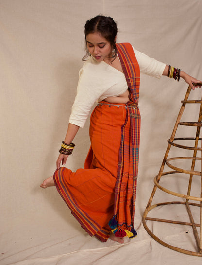 Handcrafted rust Kala Cotton saree adorned with authentic Bhujodi weaving and heritage-inspired motifs