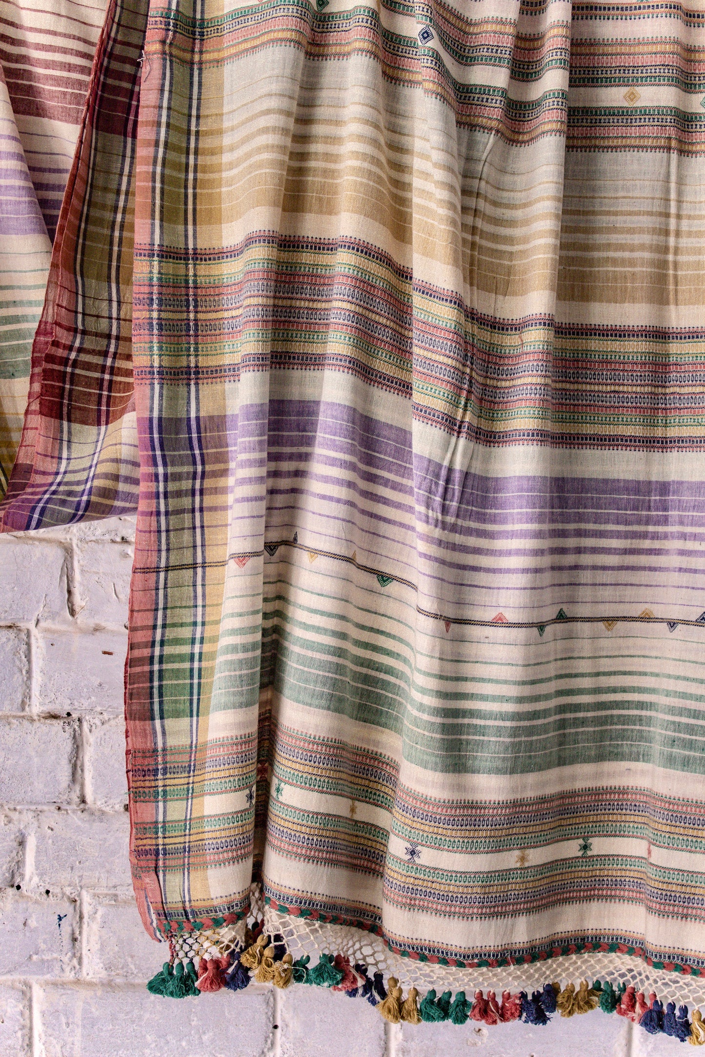 Handcrafted sand Kala Cotton saree adorned with authentic Bhujodi weaving and heritage-inspired motifs