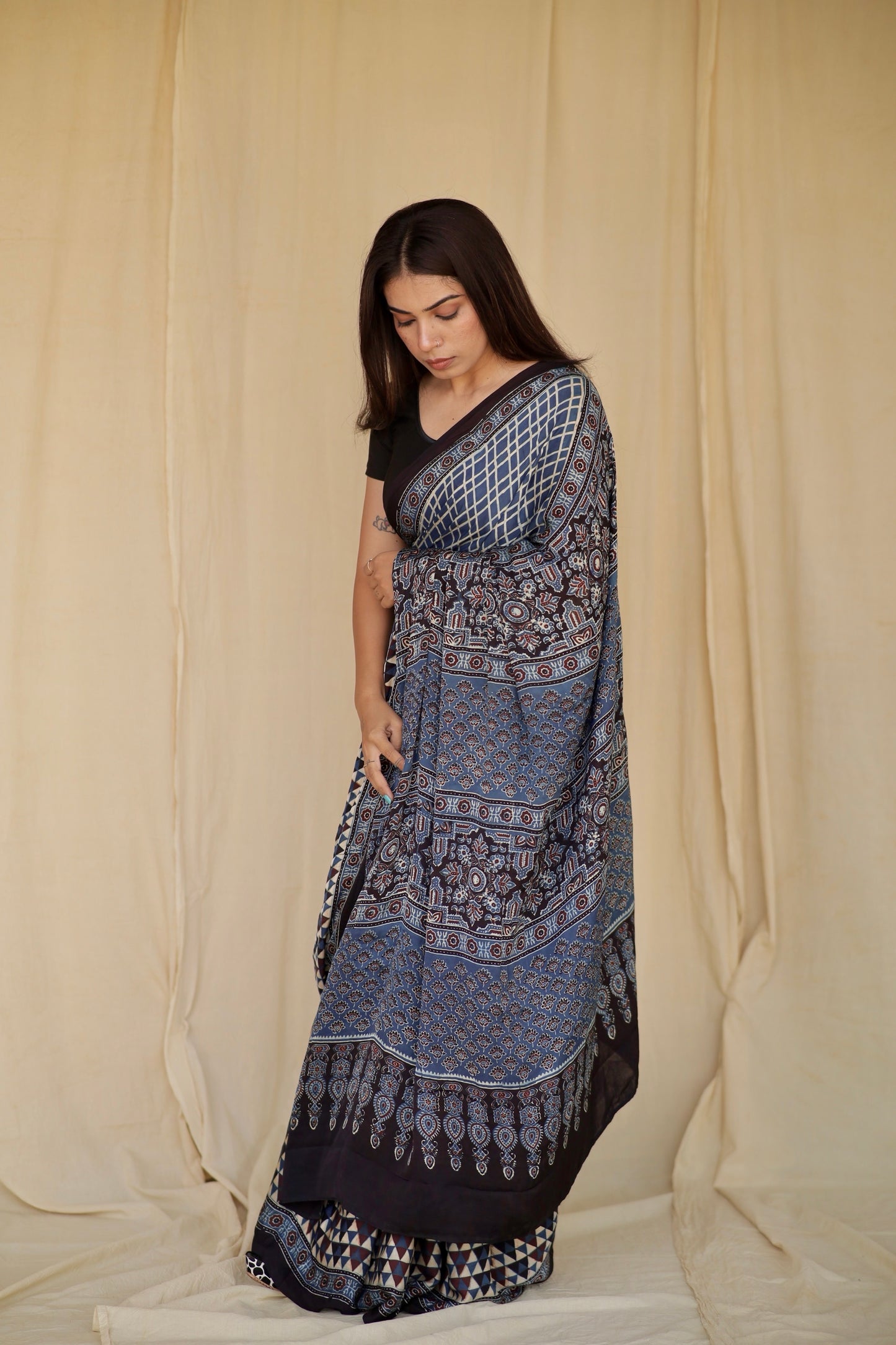 Handcrafted sapphire blue modal silk saree adorned with traditional Ajrakh patterns and refined detailing