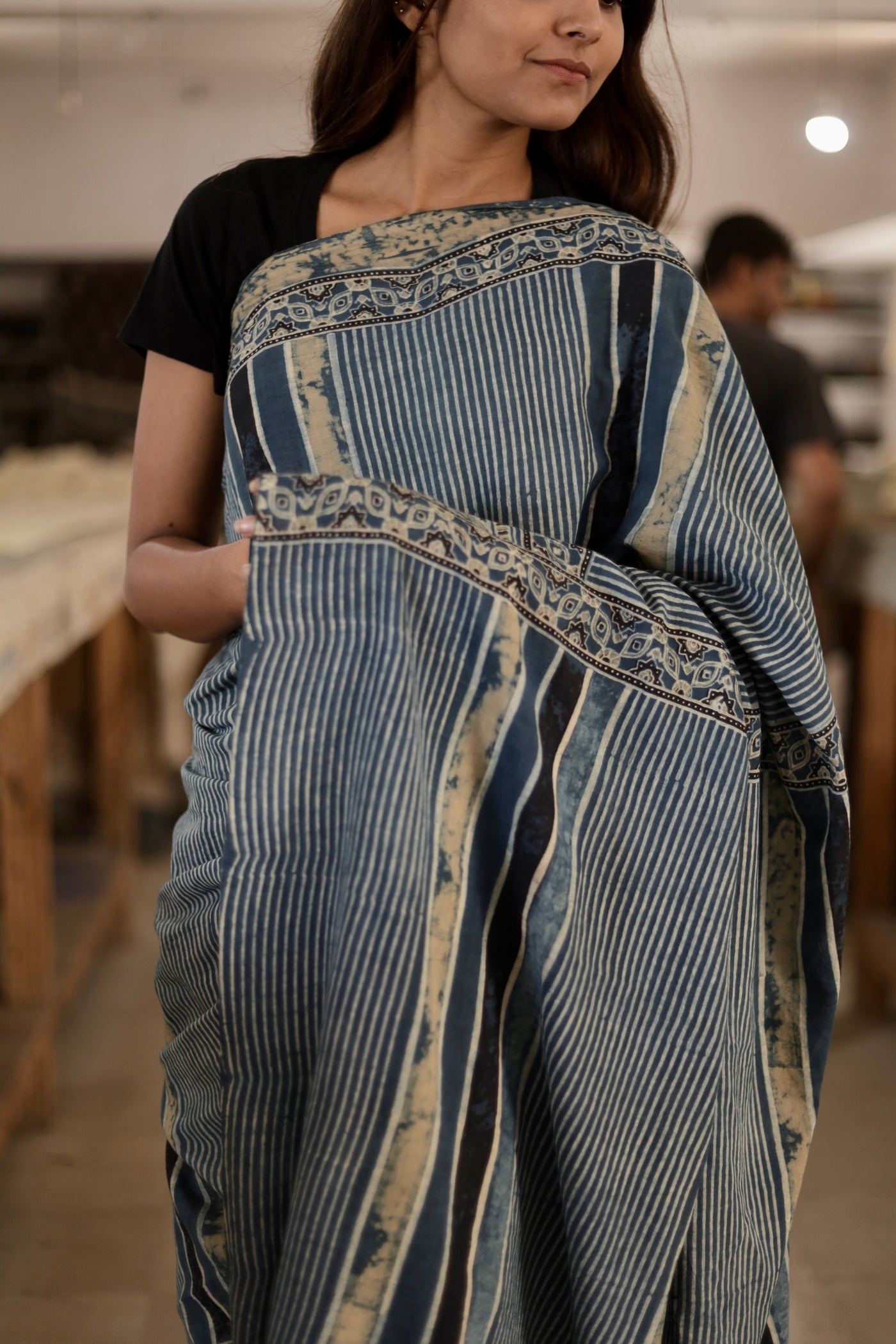 Handcrafted slate blue stripe mul cotton saree adorned with authentic Ajrakh patterns and artisanal detailing