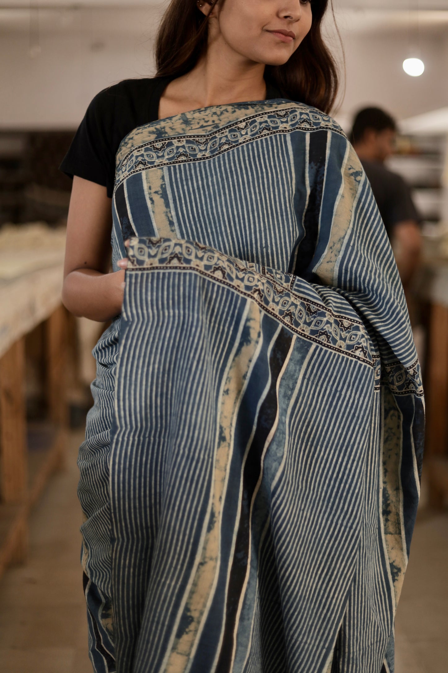 Handcrafted slate blue stripe mul cotton saree adorned with authentic Ajrakh patterns and artisanal detailing