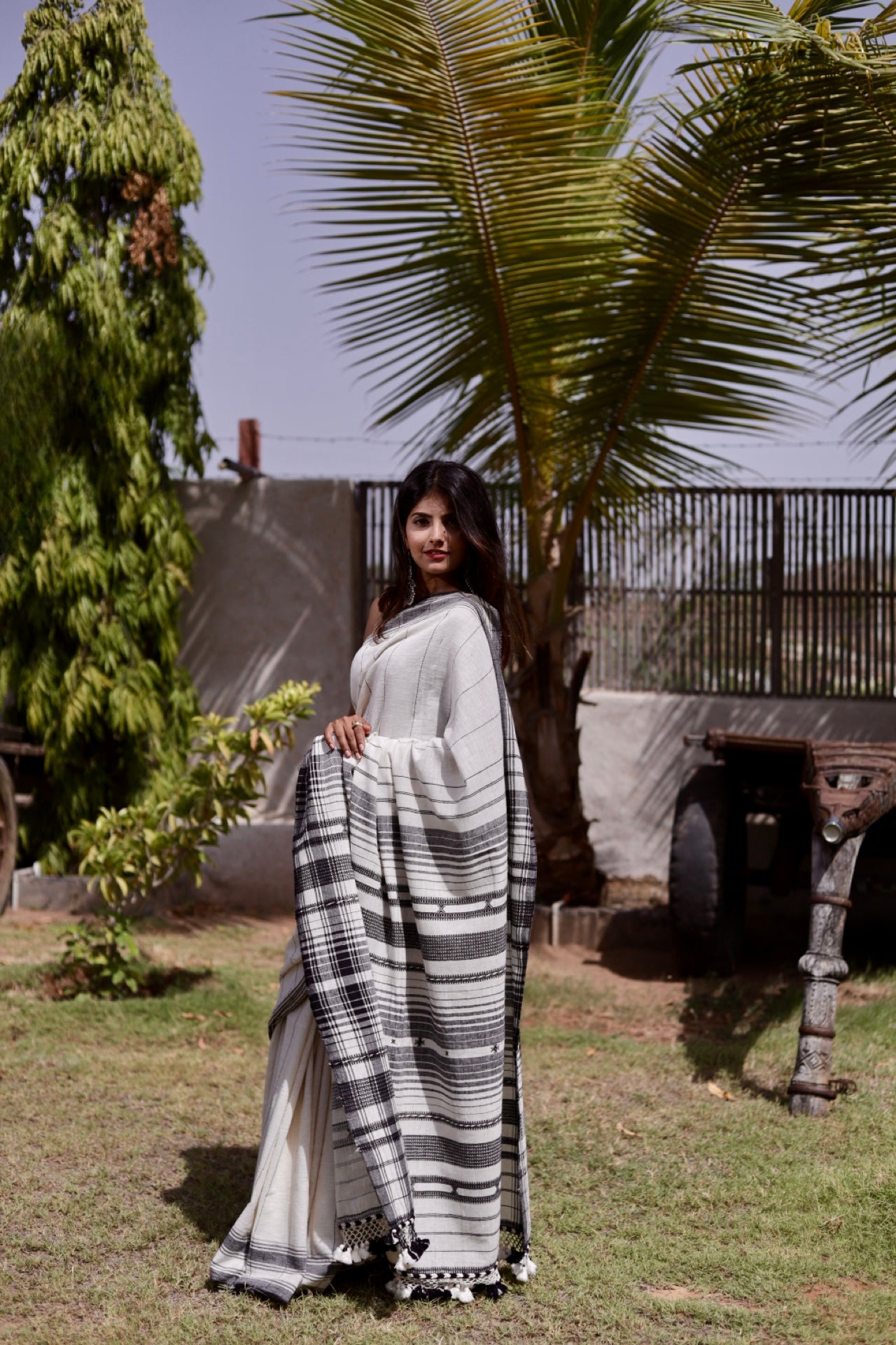 Handcrafted slate Kala Cotton saree adorned with authentic Bhujodi weaving and heritage-inspired motifs