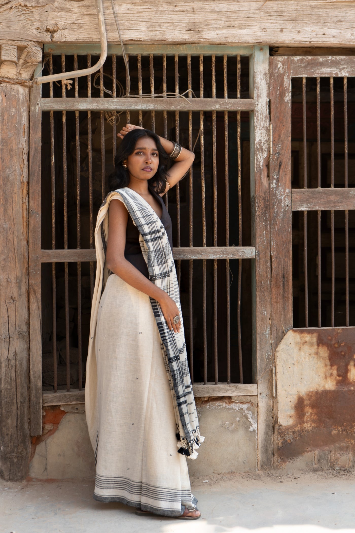 Handcrafted snowy Kala Cotton saree adorned with authentic Bhujodi weaving and heritage-inspired motifs