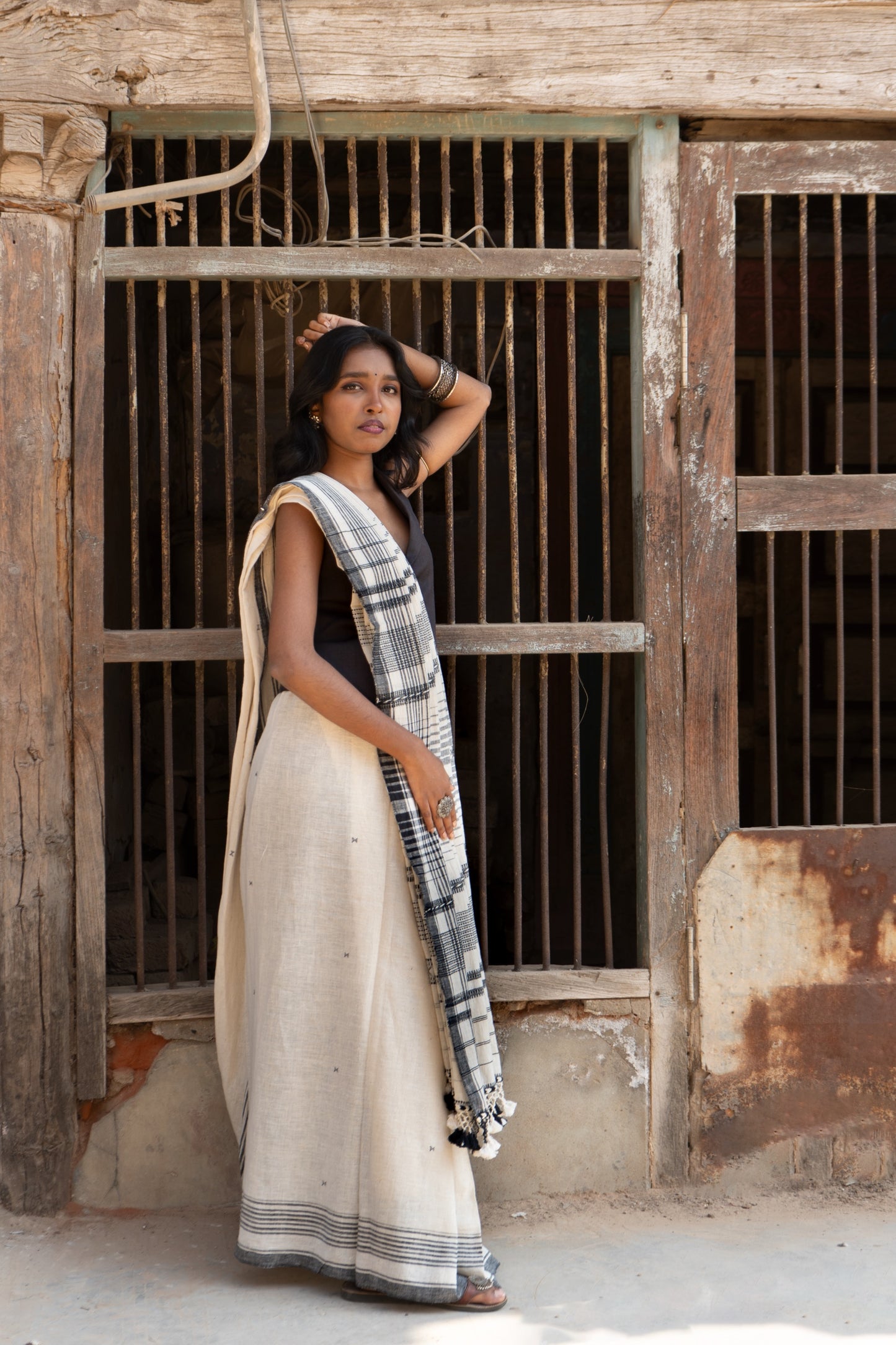 Handcrafted snowy Kala Cotton saree adorned with authentic Bhujodi weaving and heritage-inspired motifs