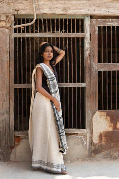 Handcrafted snowy Kala Cotton saree adorned with authentic Bhujodi weaving and heritage-inspired motifs