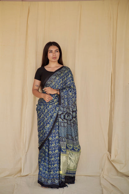 Handcrafted steel blue modal silk saree adorned with traditional Ajrakh patterns and elegant detailing