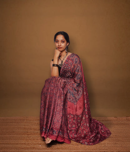 Handcrafted wine pink modal silk saree adorned with traditional Ajrakh patterns and refined detailing