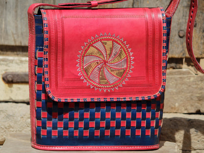 Artisan-made leather bag featuring traditional zari embroidery and fine detailing