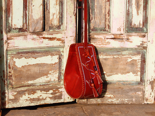 Leather potli bag with zari work