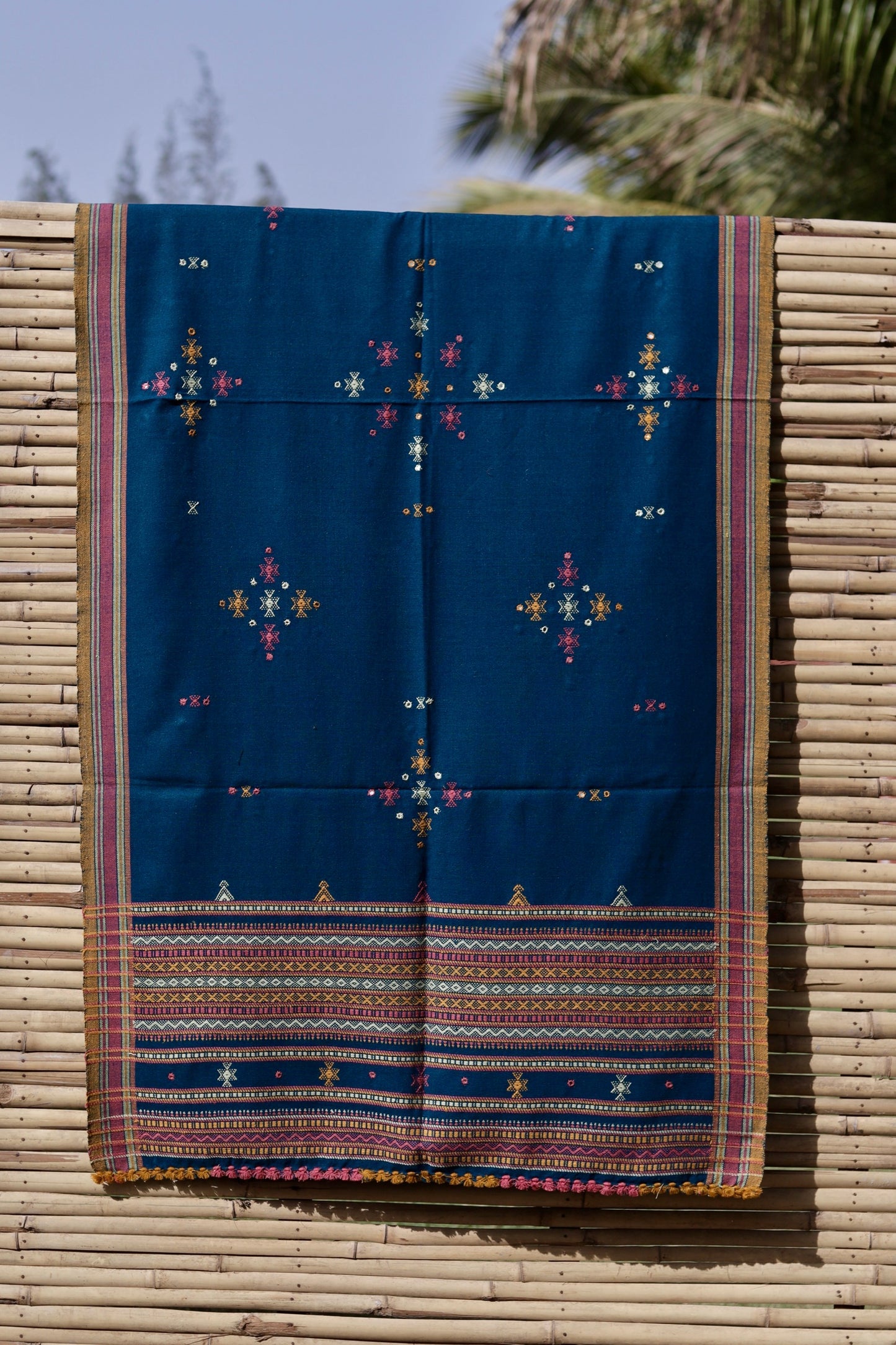 Indigo blue handwoven woolen shawl featuring rich color tones and fine artisan craftsmanship