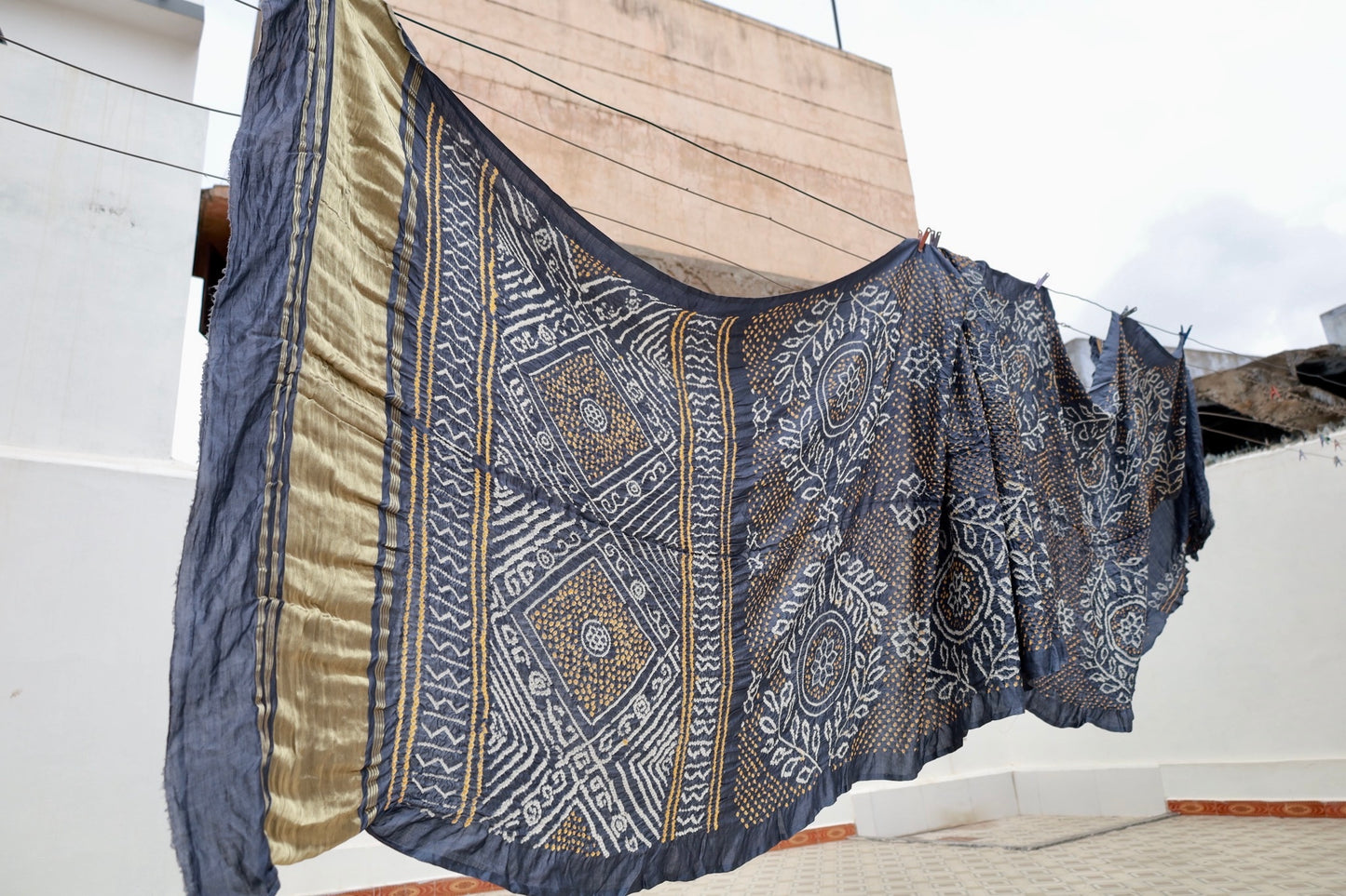 Indigo Rai Bandhani silk saree featuring intricate tie-dye patterns and an elegant zari pallu