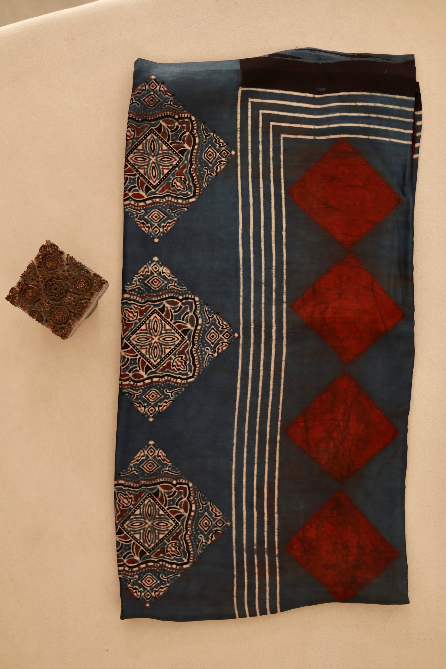 Indigo rust Ajrakh modal silk dupatta featuring intricate hand block printed motifs and elegant drape
