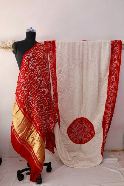 Ivory red Bandhani Gajji silk saree featuring intricate tie-dye patterns and an elegant zari pallu