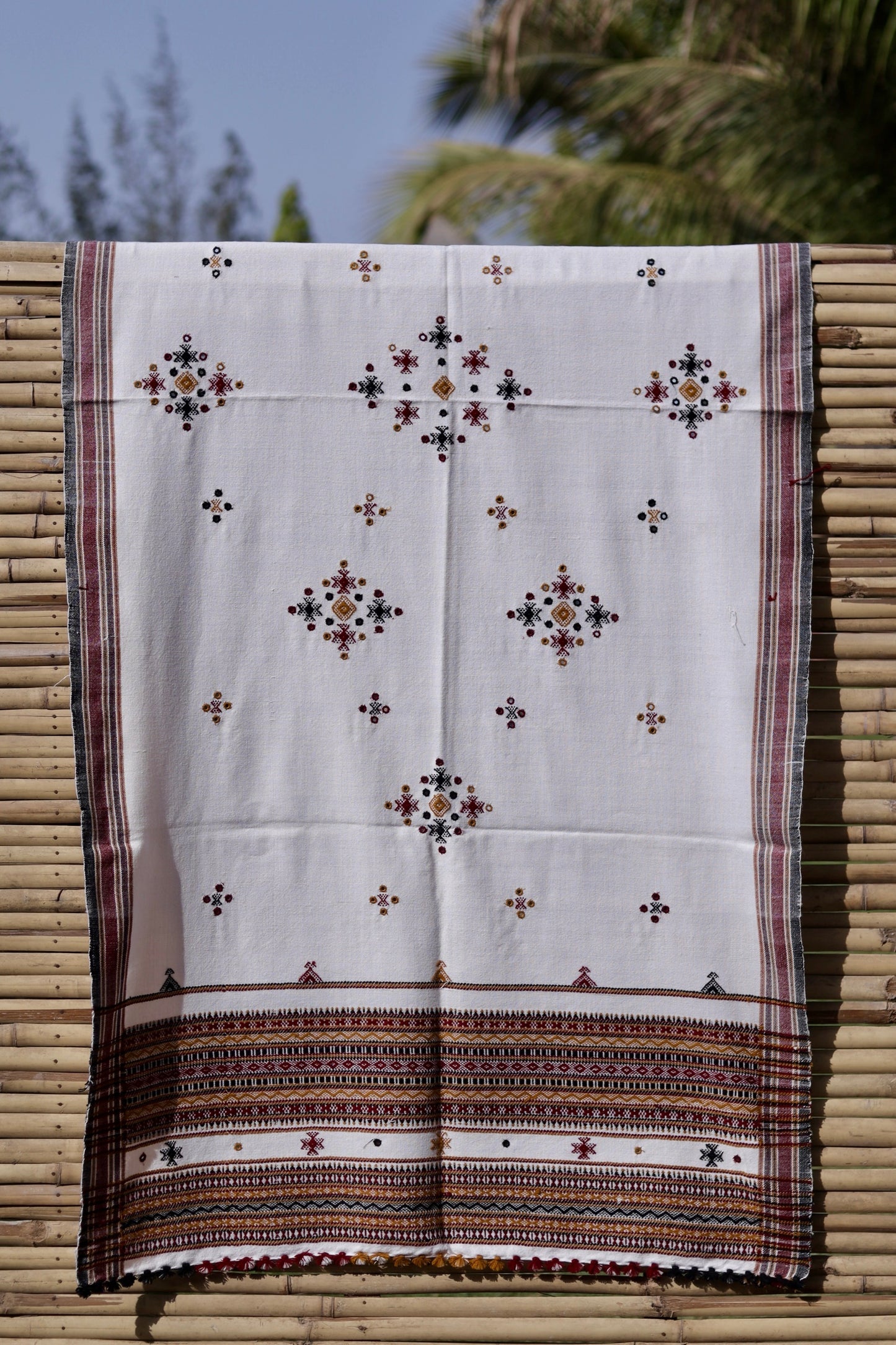 Ivory white handwoven woolen shawl featuring a soft texture and exquisite artisan craftsmanship