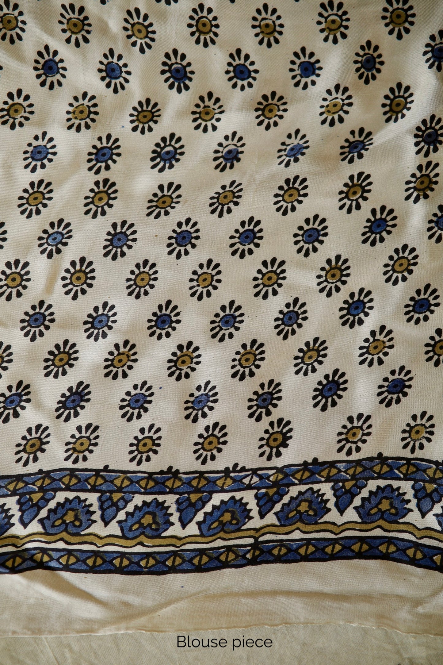 Ivory white modal silk saree with heritage-inspired Ajrakh designs and a soft flowing texture. Traditional ivory white Ajrakh printed modal silk saree crafted by artisans with refined craftsmanship