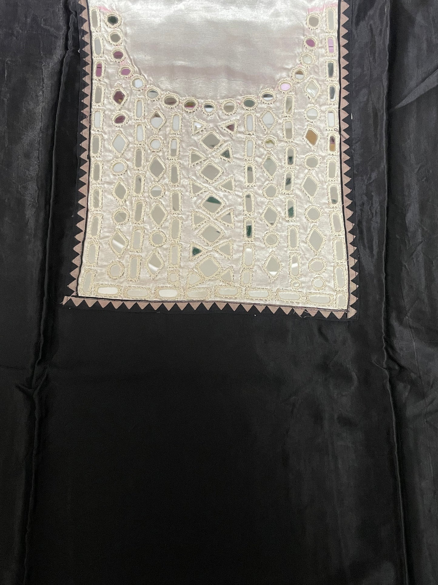 Jet black mirror work dress material showcasing intricate handcrafted embellishments