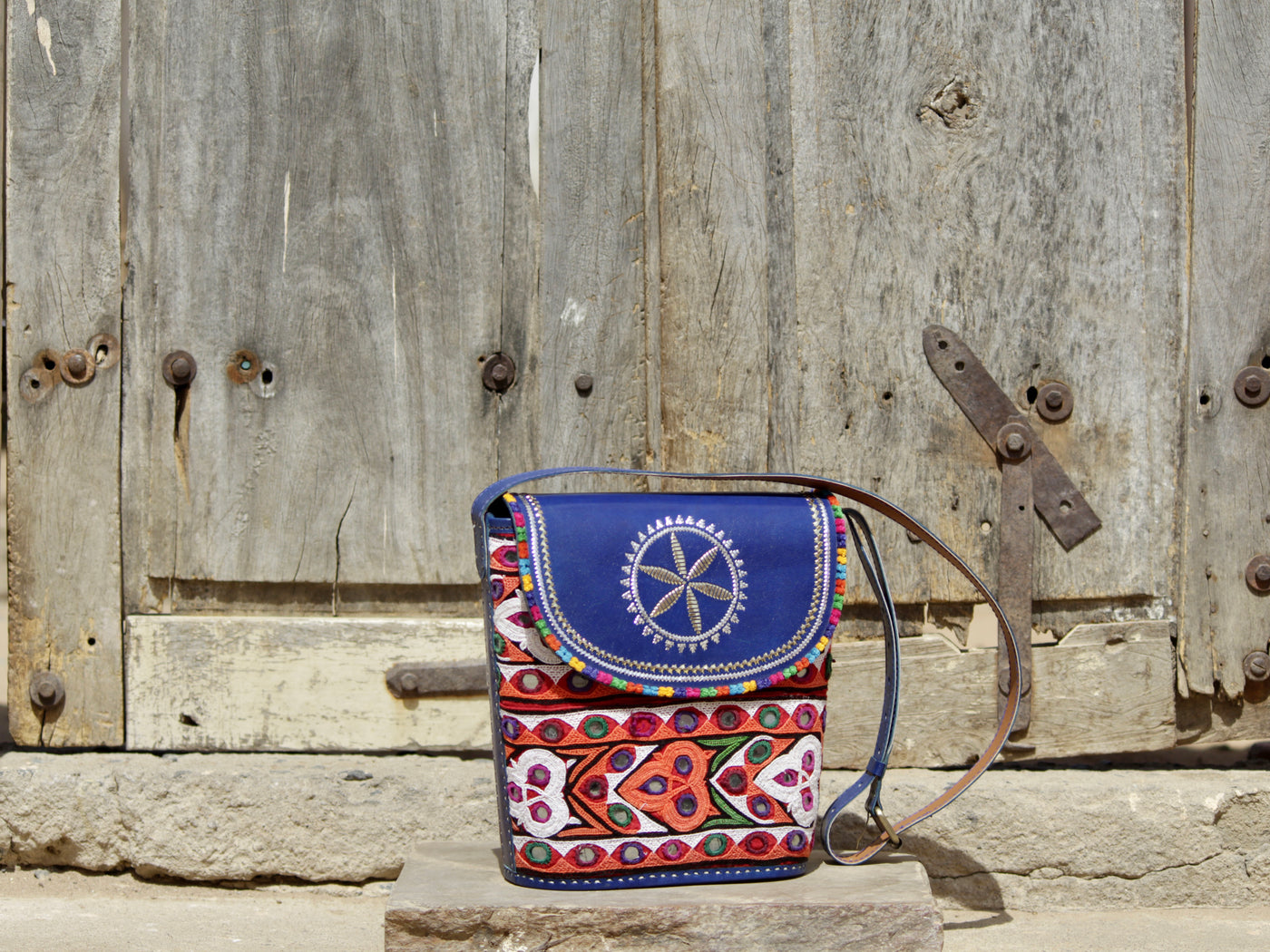 Leather bag featuring authentic Kutchi embroidery and intricate zari work on premium leather